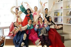 Armenian students in traditional Korean clothes are taking a picture in a funny pose